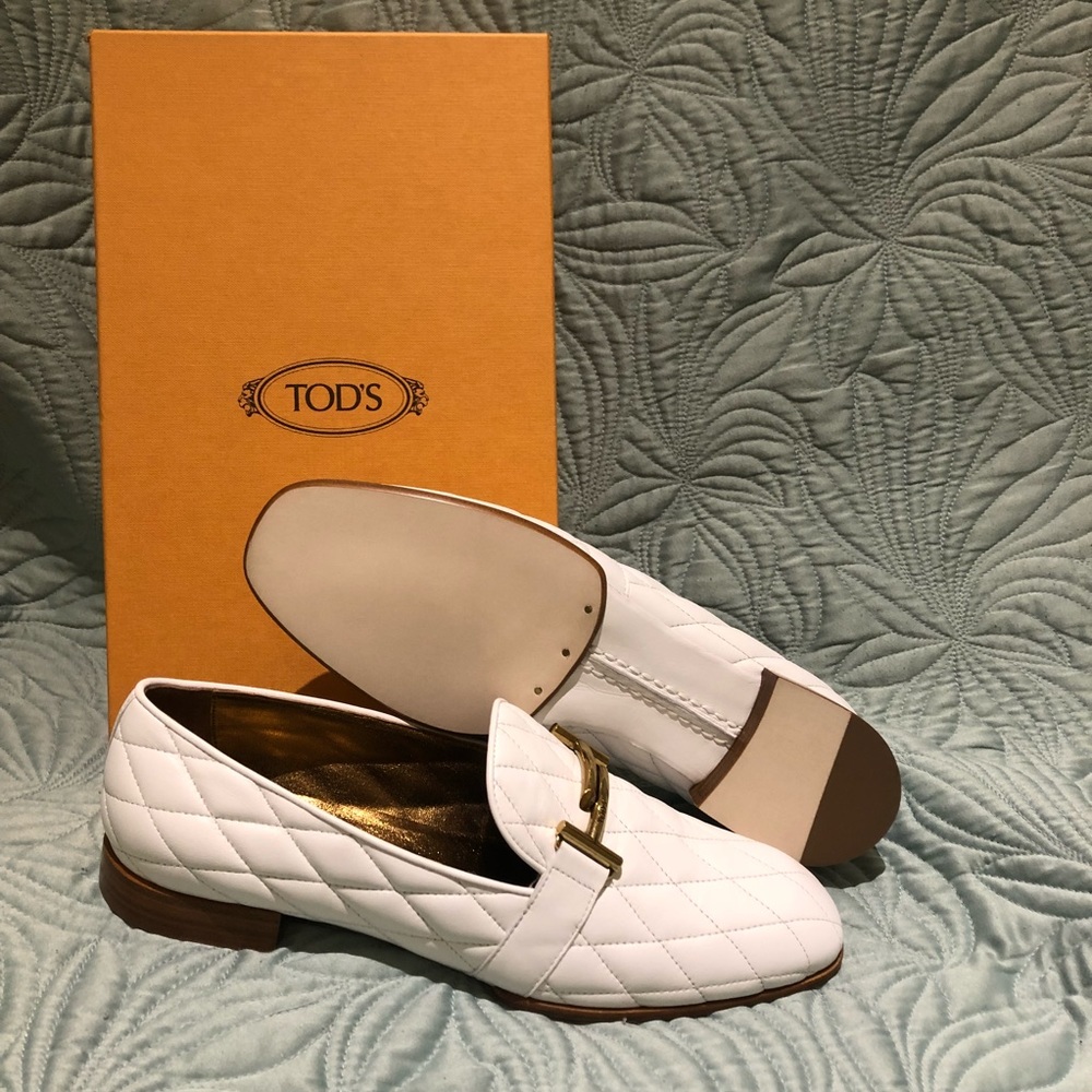 Tod’s White quilted loafers with gold accents